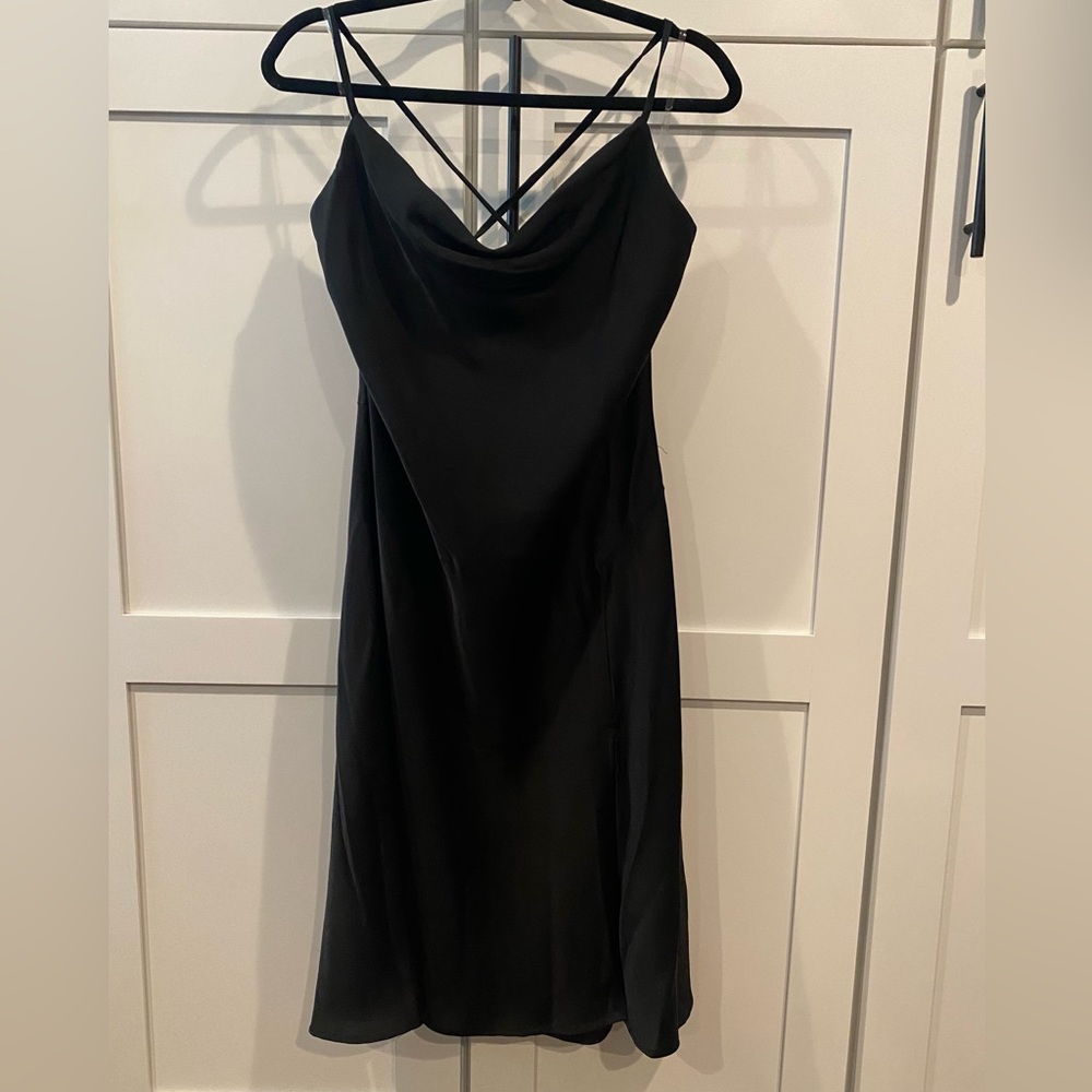 Black slip midi dress with cowl neck, side slit, and tie in back
